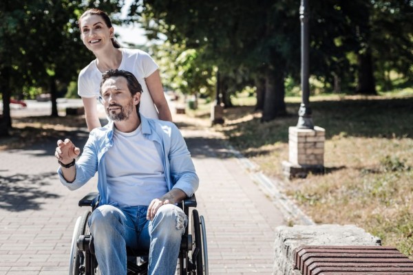 Man woman wheelchair park disability i Stock 936915690