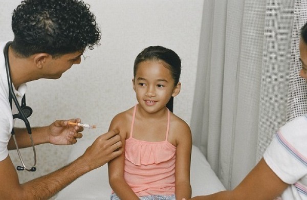 Young asian girl getting vaccine