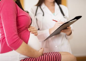 Pregnant woman doctor maternal health community