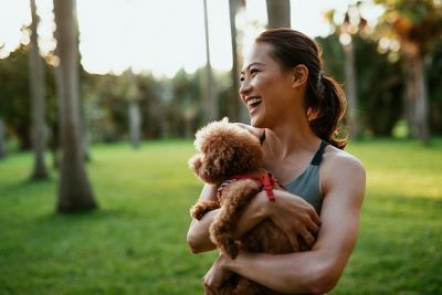 Woman holding dog