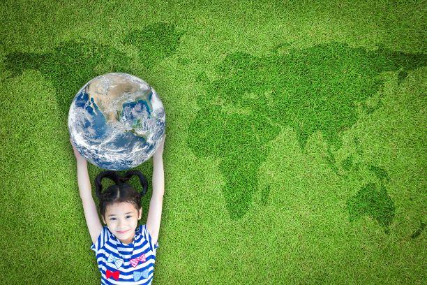 Little girl holding globe environmental