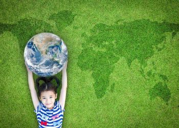 Little girl holding globe environmental