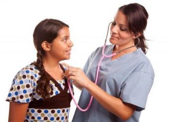 Nurse checking childs heartbeat 500x333