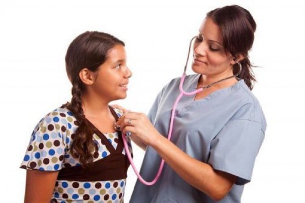 Nurse checking childs heartbeat 500x333